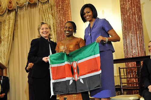 Secretary Clinton Shakes Hands With Honoree Ann Njogue