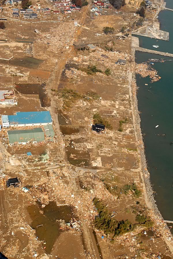 An aerial view of tsunami damage in an area north of Sendai, Japan, taken from a U.S. Navy helicopter assigned to the aircraft carrier USS Ronald Reagan (CVN 76).