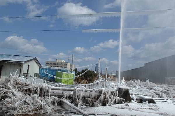 A damaged water pipe shoots into the air after a tsunami triggered by a 8.9 magnitude earthquake off the Northeastern coast of Japan.